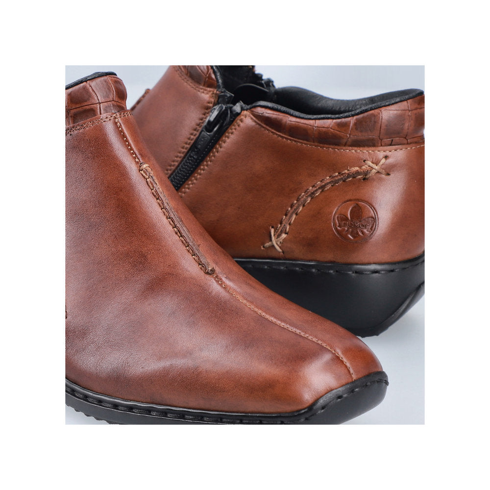 Rieker L3882-24 women's brown leather twin zip ankle boots, lifestyle view.
