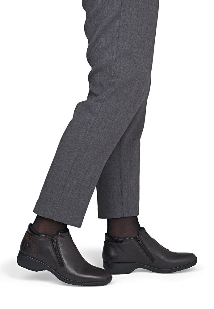 Rieker L3882-25 women's narrow brown leather side zip ankle boots, on-foot lifestyle view.
