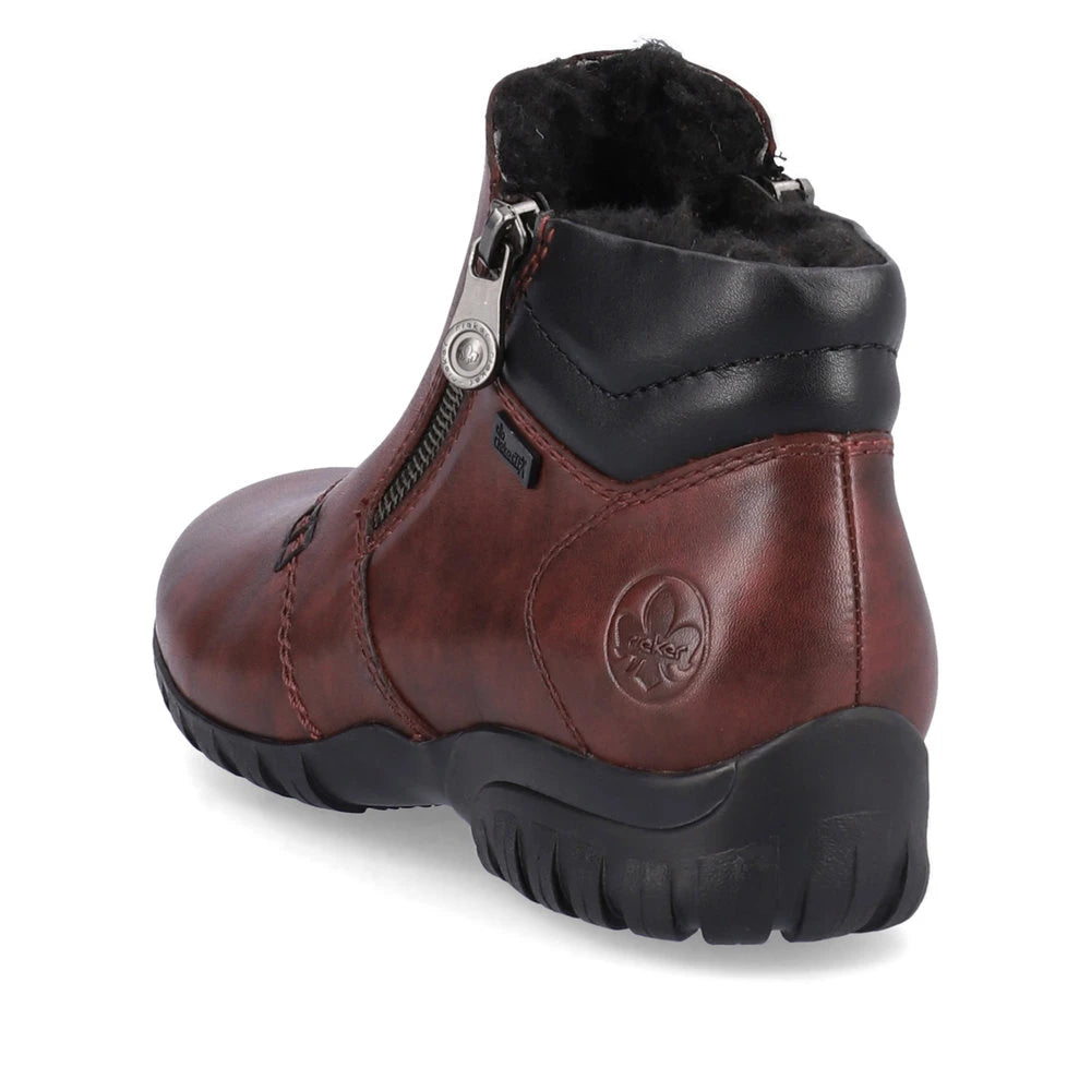 Rieker L4655-35 women's wide red leather water resistant side zip ankle boots, rear three-quarter view.