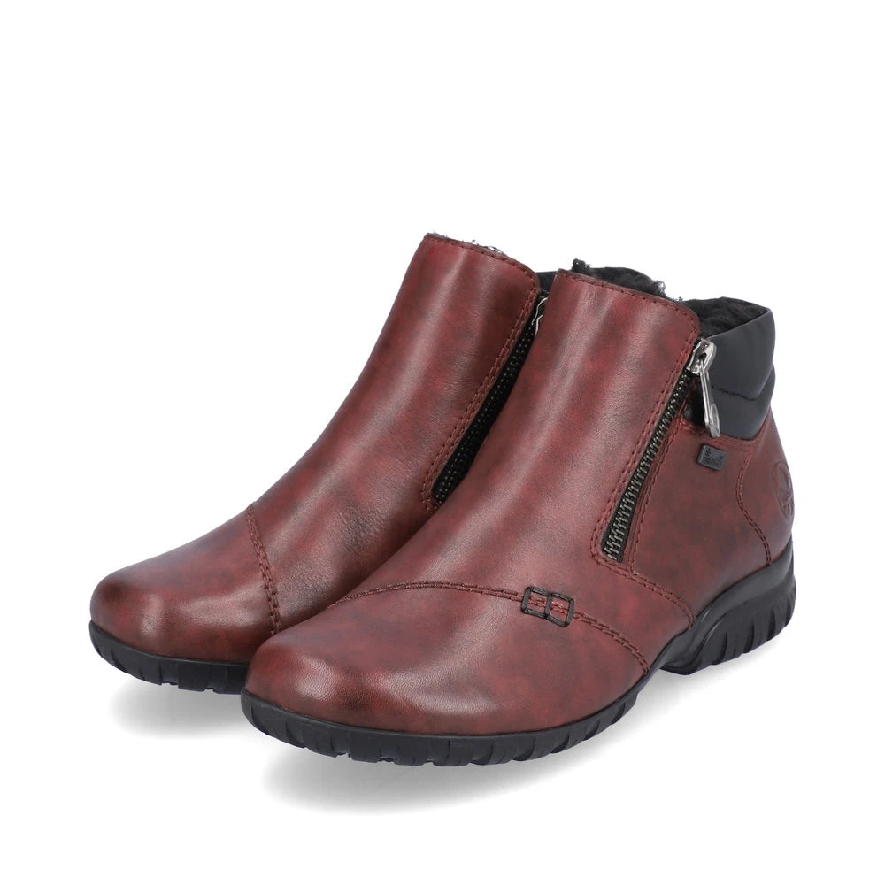 Rieker L4655-35 women's wide red leather water resistant side zip ankle boots, paired three-quarter view.