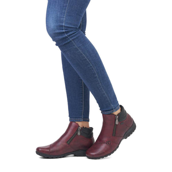 Rieker L4655-35 women's wide red leather water resistant side zip ankle boots, on-foot lifestyle view.