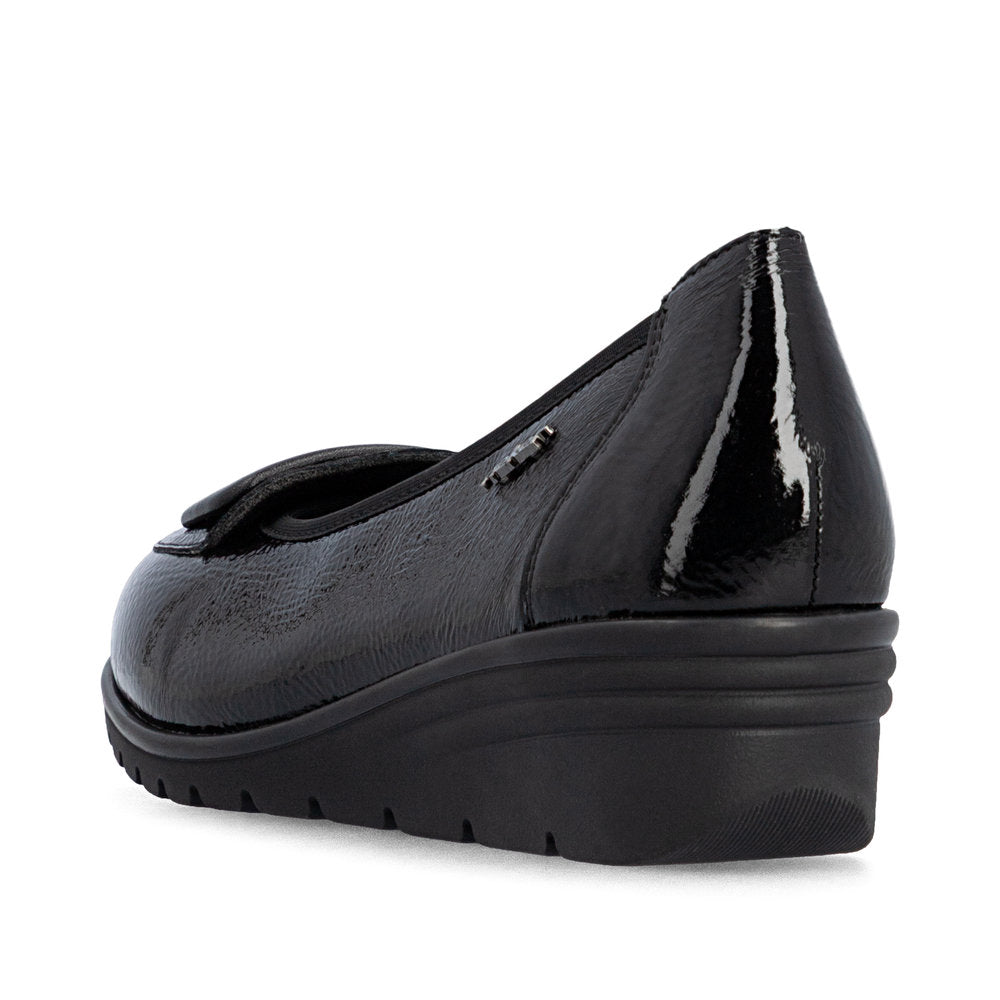 Rieker L5362-00 women's black slip on shoes, rear three-quarter view.