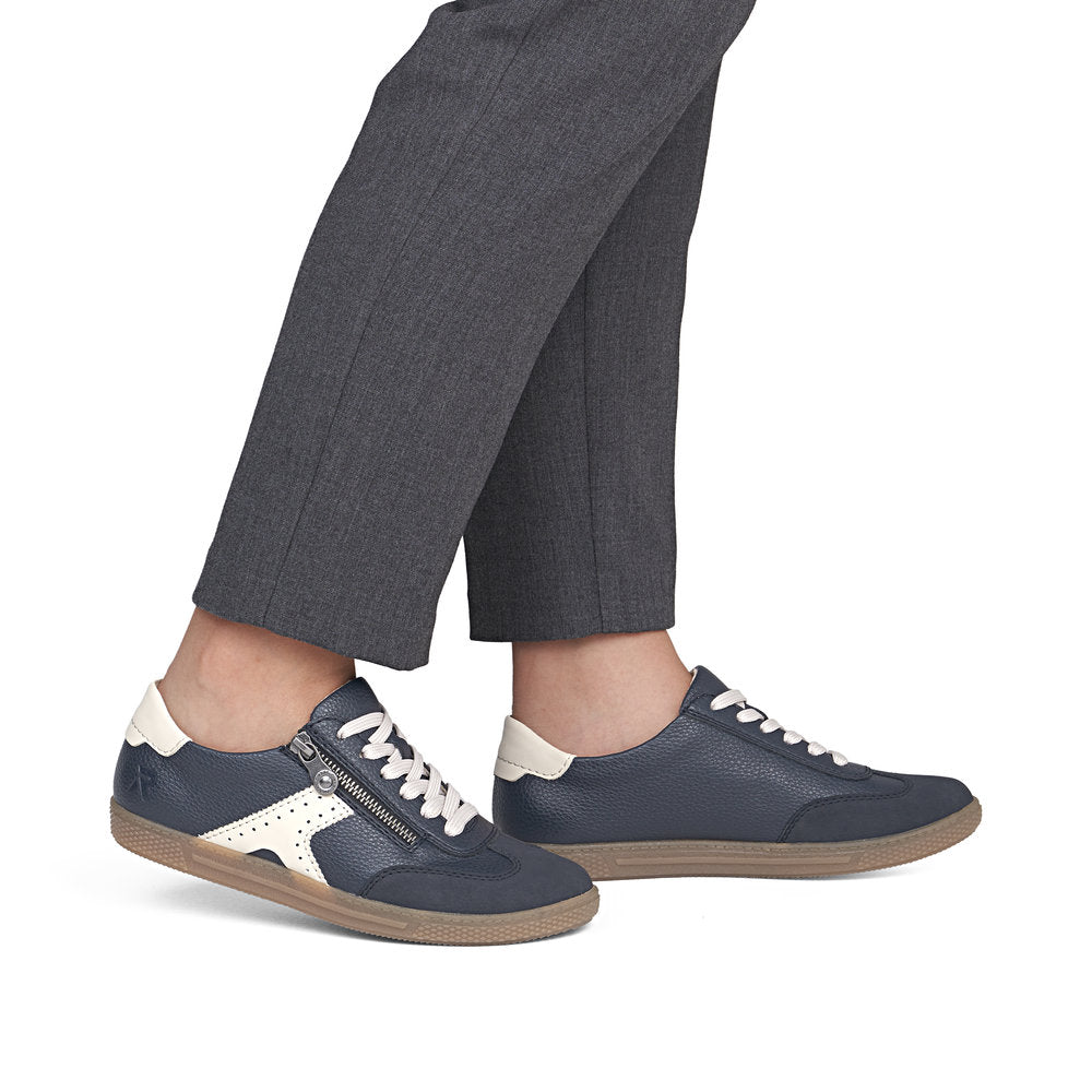Rieker L9700-14 women's navy zip & lace trainers, on-foot lifestyle view.