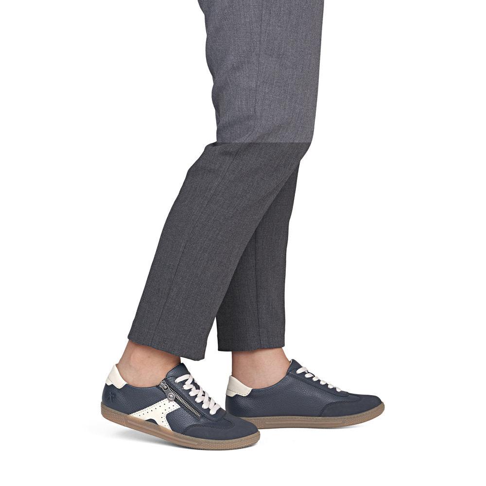 Rieker L9700-14 women's navy zip & lace trainers, on-foot lifestyle view.