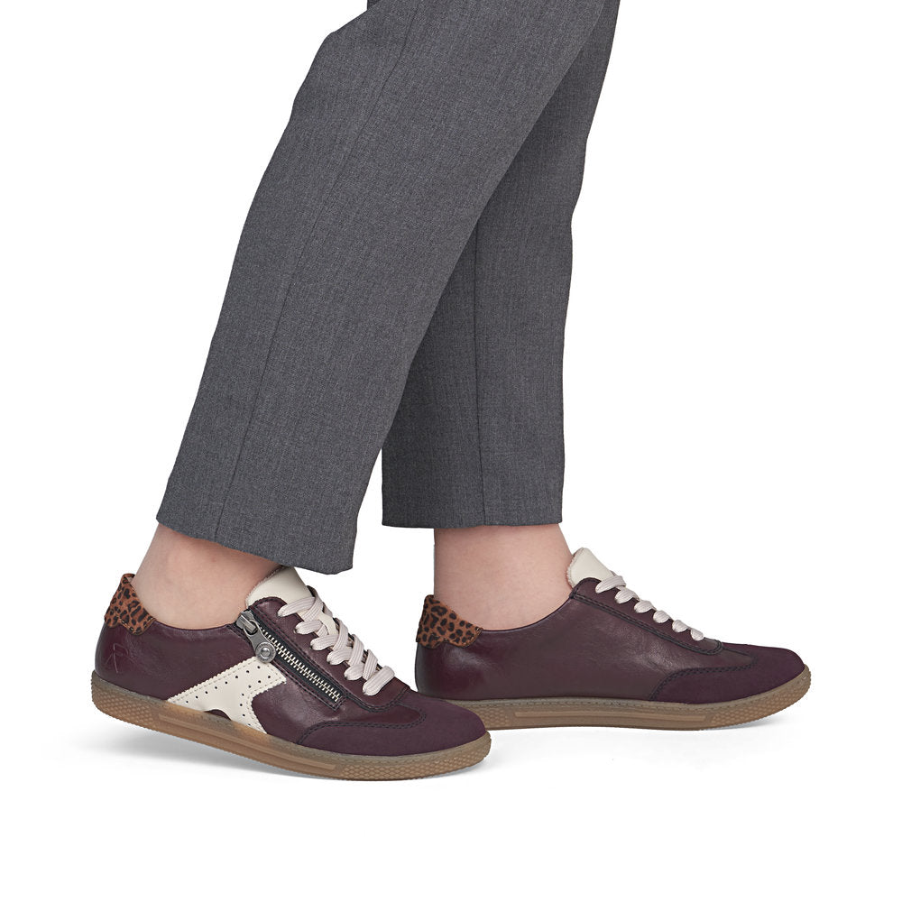 Rieker L9700-30 women's brown zip & lace trainers, on-foot lifestyle view.