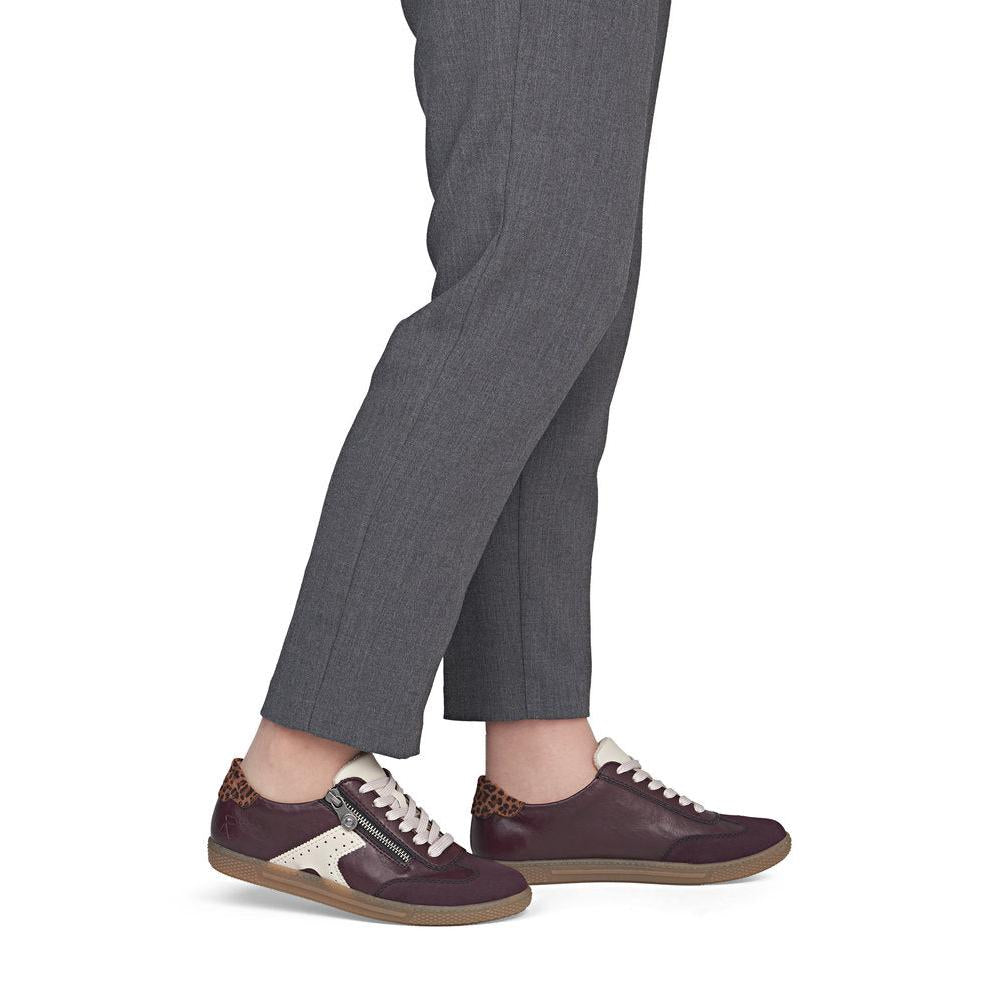 Rieker L9700-30 women's brown zip & lace trainers, on-foot lifestyle view.