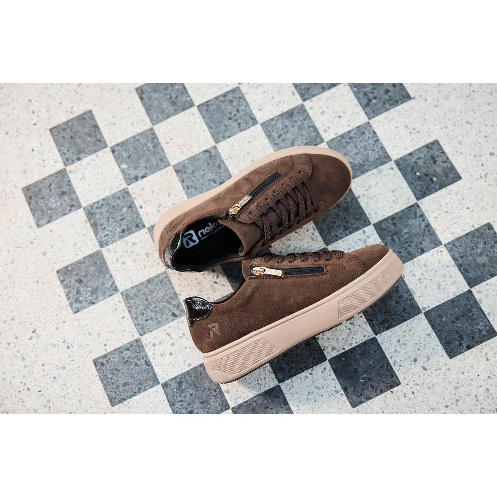Rieker M7701-25 women's brown suede zip & lace trainers, lifestyle view 1 of 4.