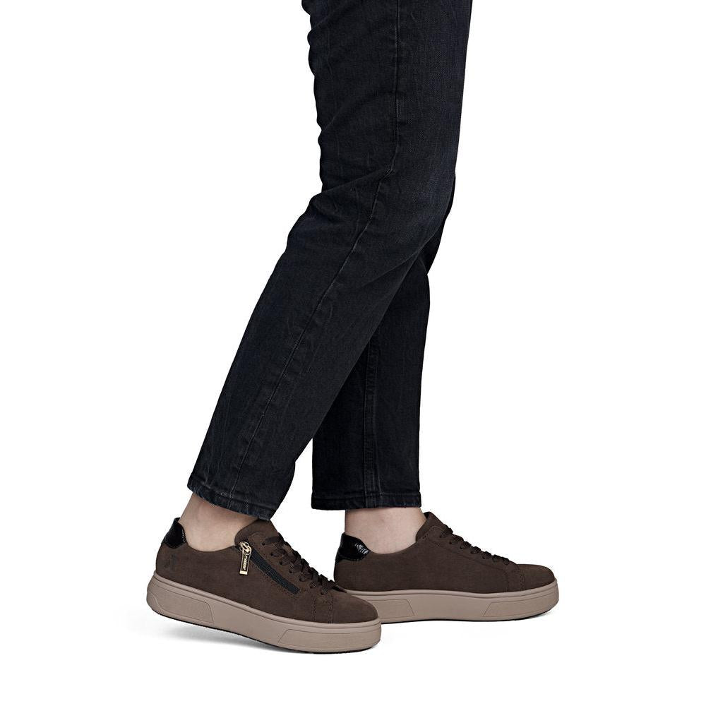 Rieker M7701-25 women's brown suede zip & lace trainers, on-foot lifestyle view.