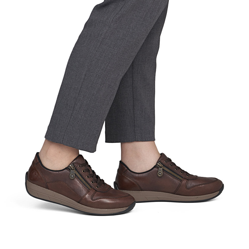 Rieker N1100-22 women's wide brown leather zip & lace shoes, on-foot lifestyle view.