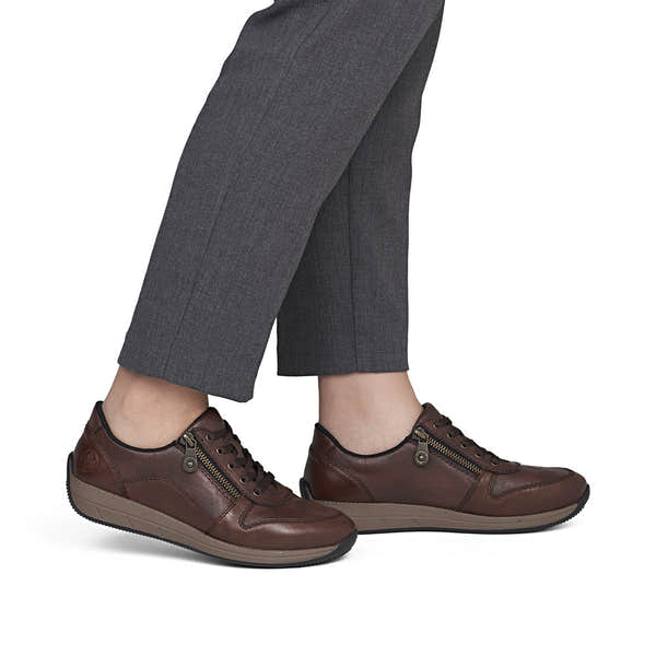 Rieker N1100-22 women's wide brown leather zip & lace shoes, on-foot lifestyle view.