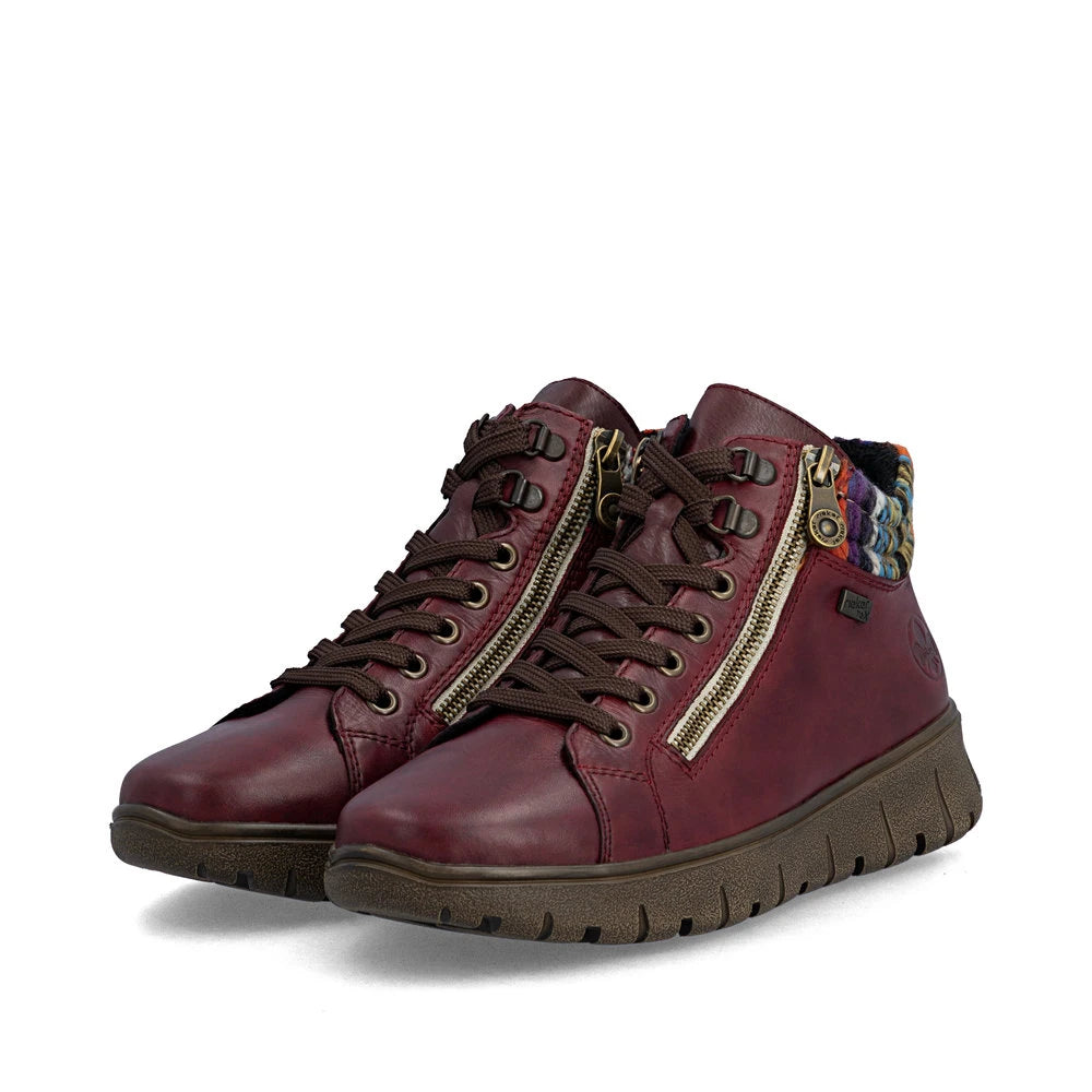 Rieker N1305-35 women's red leather zip & lace ankle boots, paired three-quarter view.
