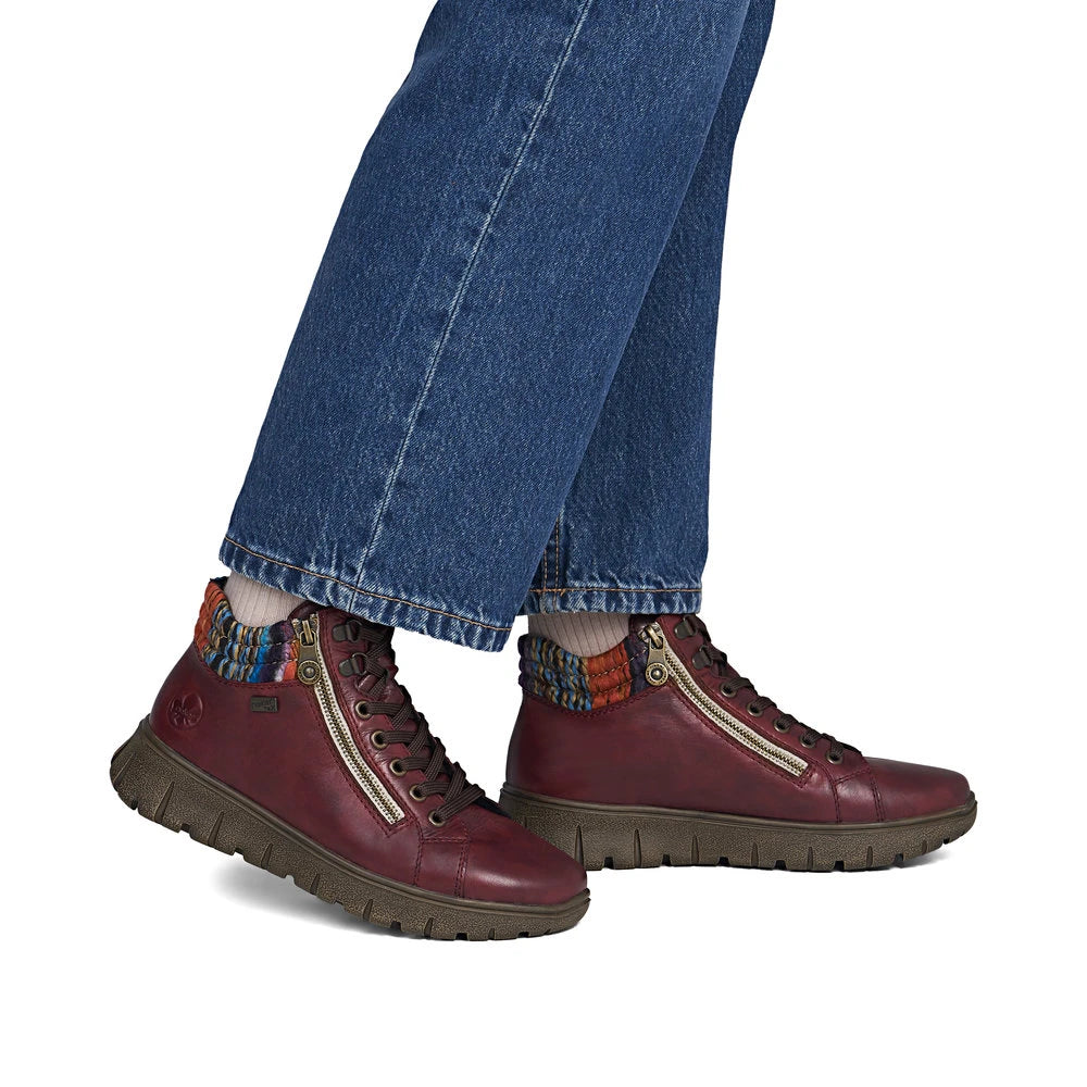 Rieker N1305-35 women's red leather zip & lace ankle boots, on-foot lifestyle view.