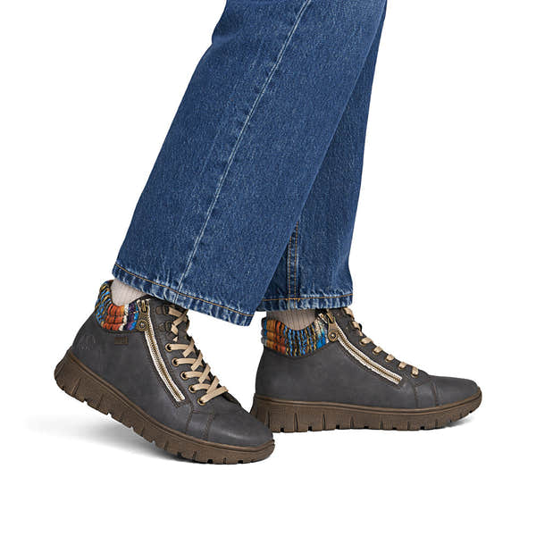 Rieker N1305-45 women's wide grey leather water resistant zip & lace ankle boots, on-foot lifestyle view.