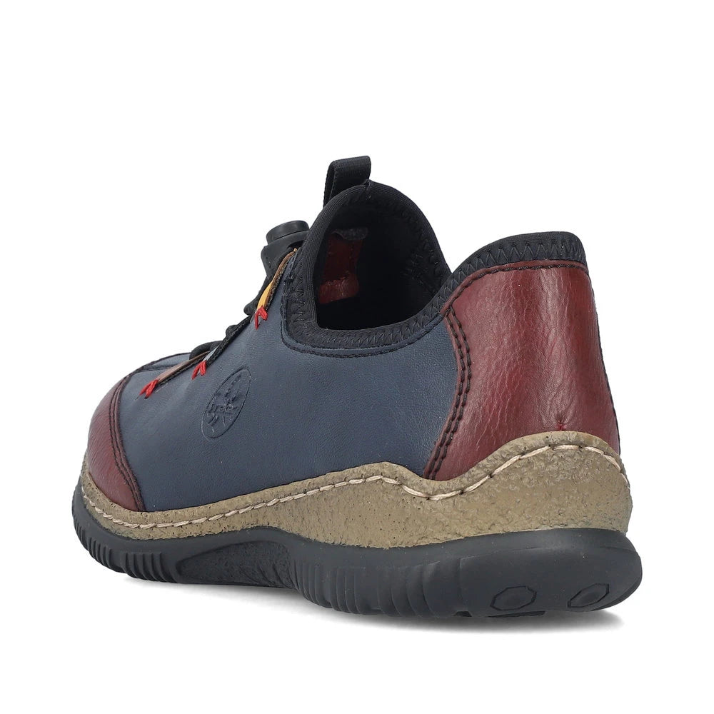 Rieker N3271-35 women's blue combination slip on shoes, rear three-quarter view.