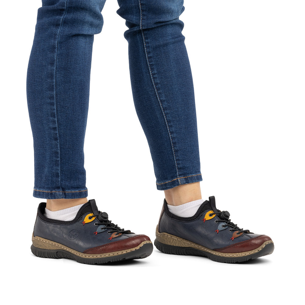 Rieker N3271-35 women's blue combination slip on shoes, on-foot lifestyle view.
