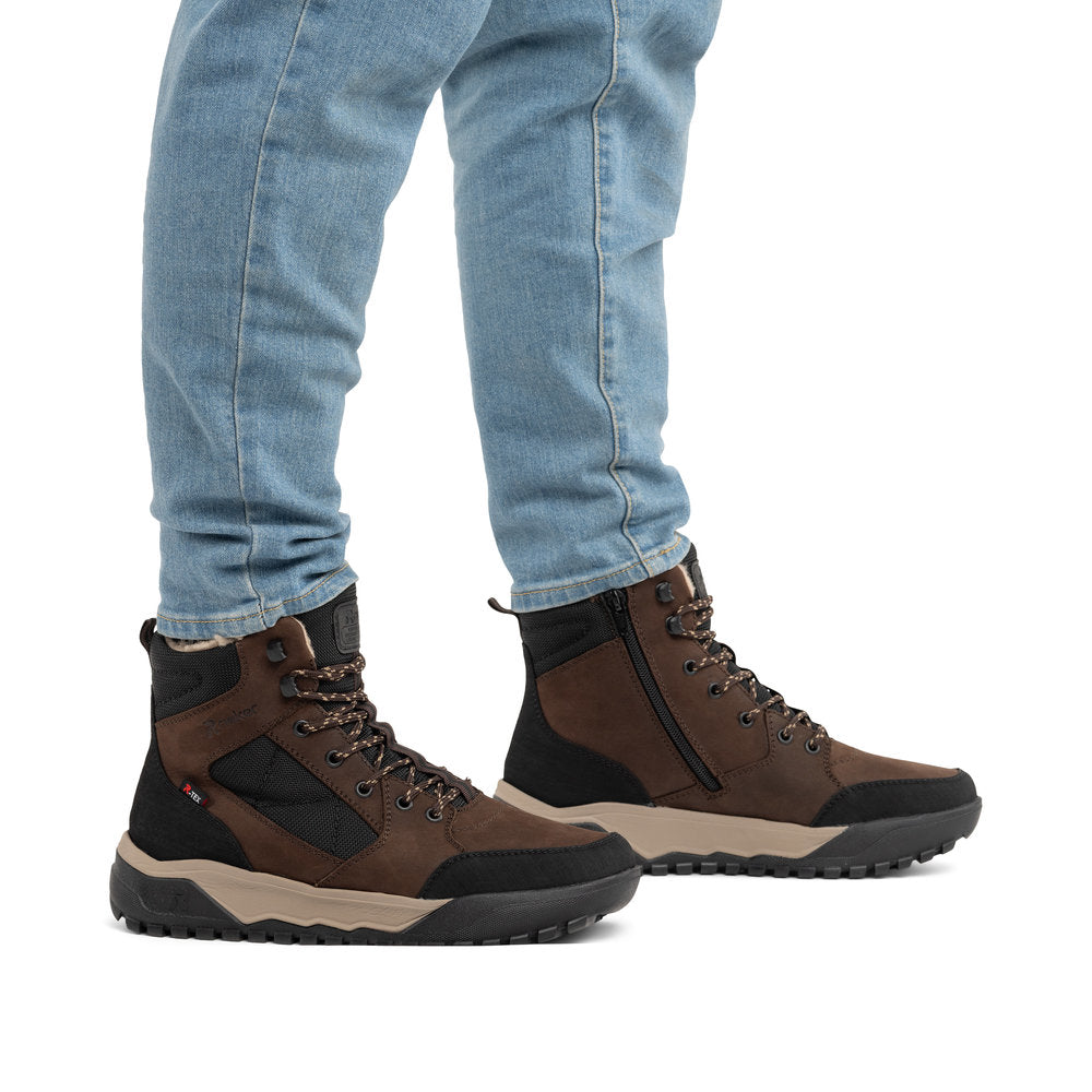 Rieker U1510-25 men's wide brown/black leather & textile water resistant lace up ankle boots, on-foot lifestyle view.