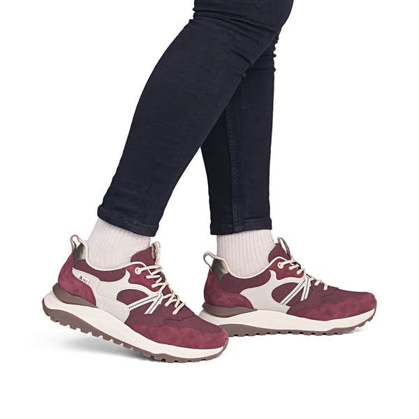 Rieker W2501-35 women's bordeaux leather water resistant lace up trainers, on-foot lifestyle view.