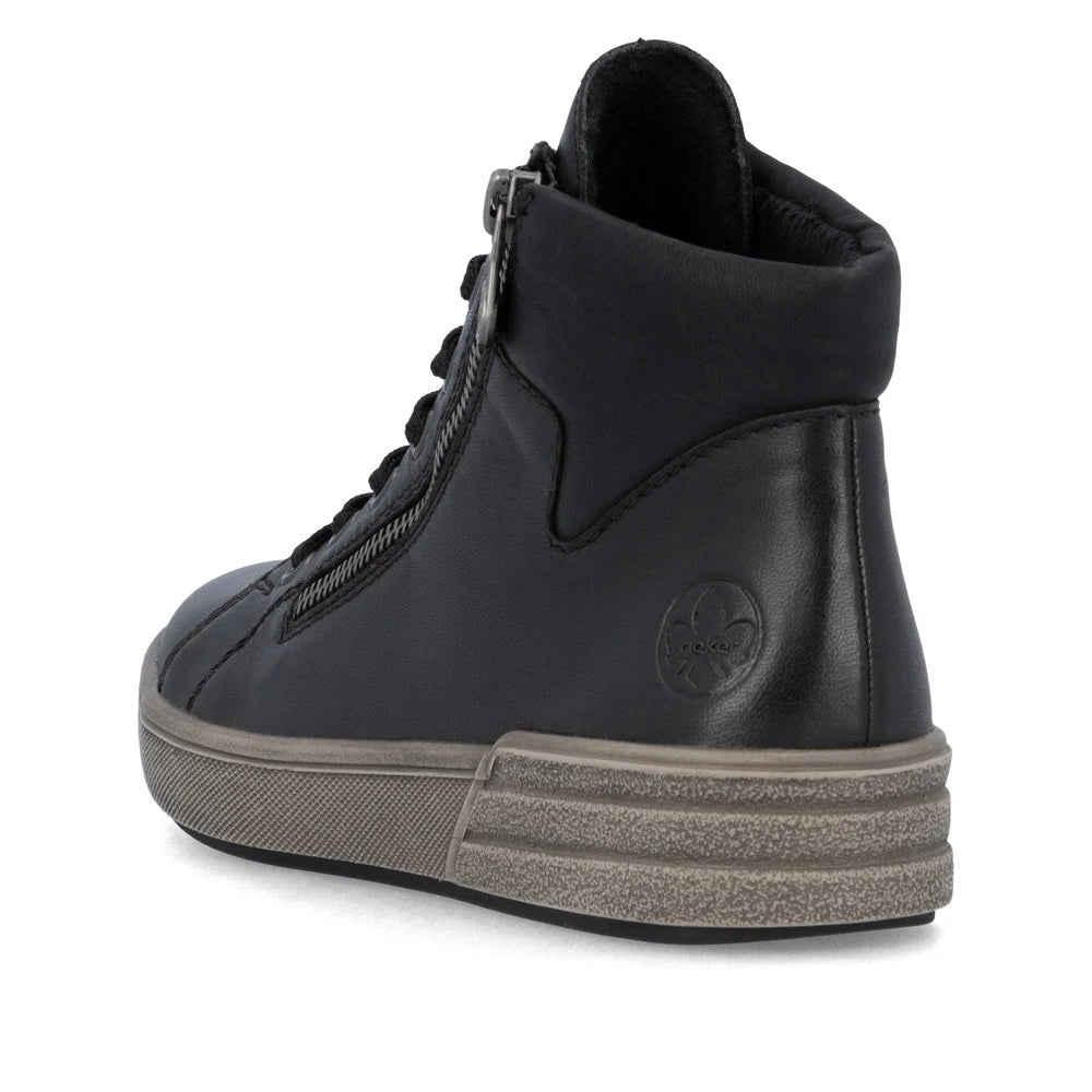 Rieker X0709-01 women's black leather zip & lace ankle boots, rear three-quarter view.