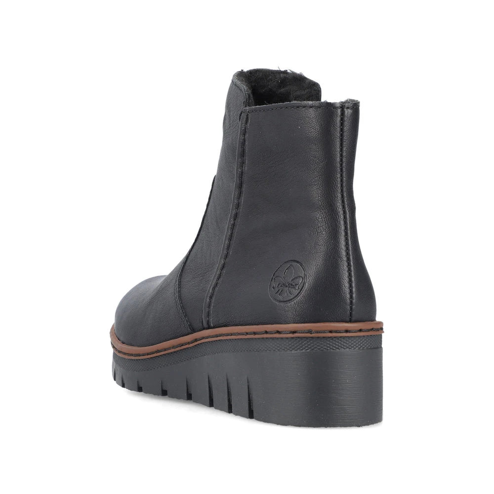 Rieker X9165-00 women's black side zip ankle boots, rear three-quarter view.