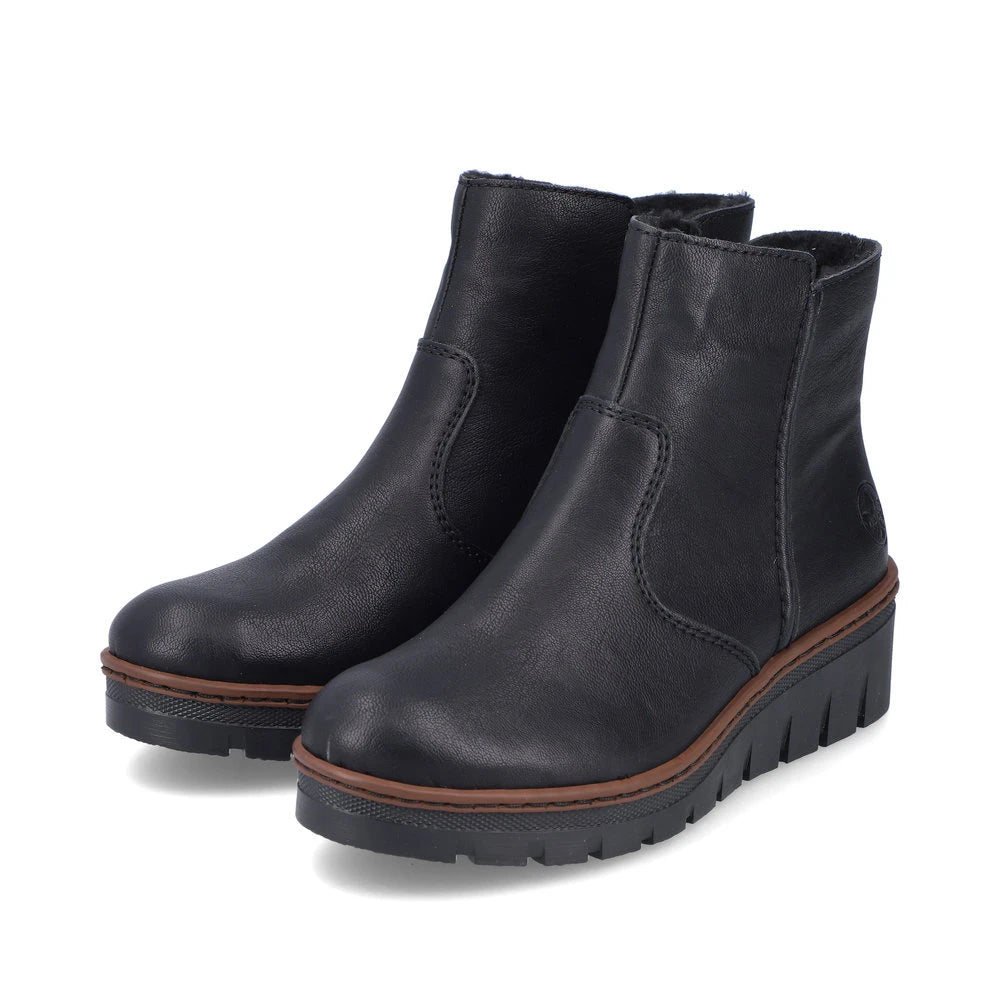 Rieker X9165-00 women's black side zip ankle boots, paired three-quarter view.