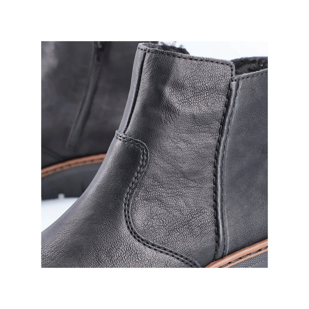 Rieker X9165-00 women's black side zip ankle boots, lifestyle view.