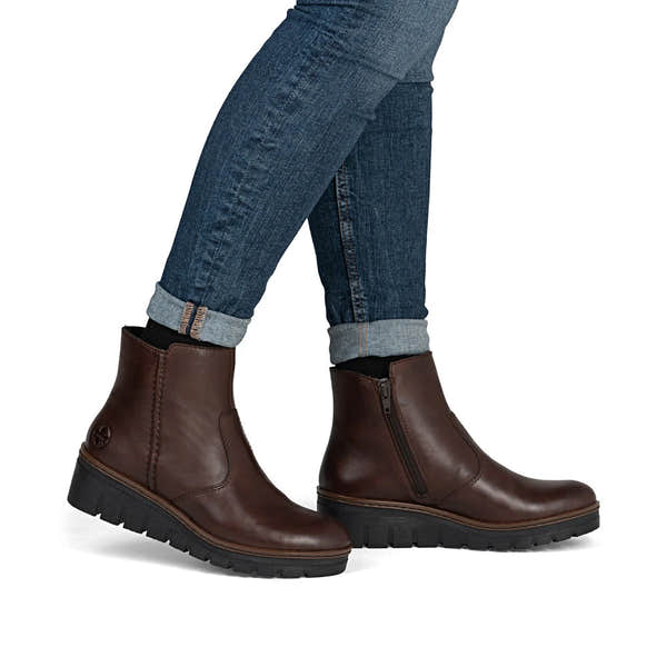 Rieker X9165-27 women's brown leather side zip ankle boots, on-foot lifestyle view.