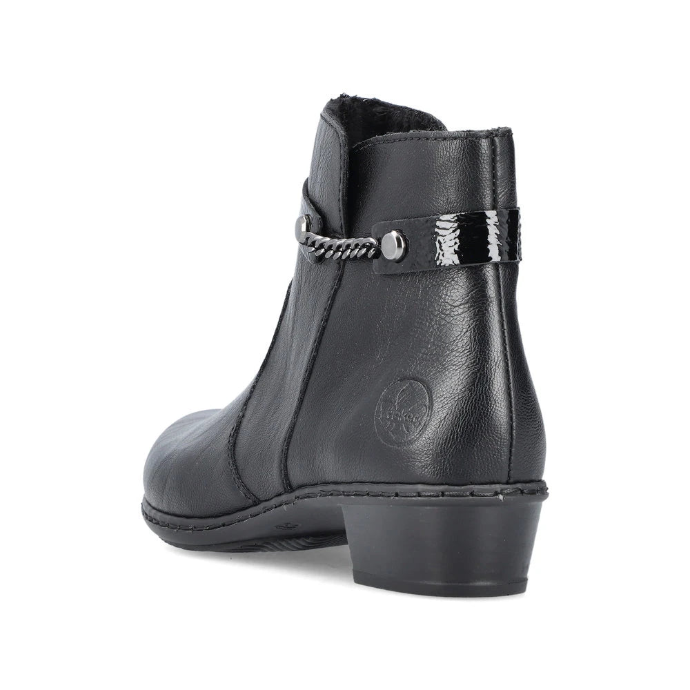 Rieker Y0783-00 women's black side zip ankle boots, rear three-quarter view.