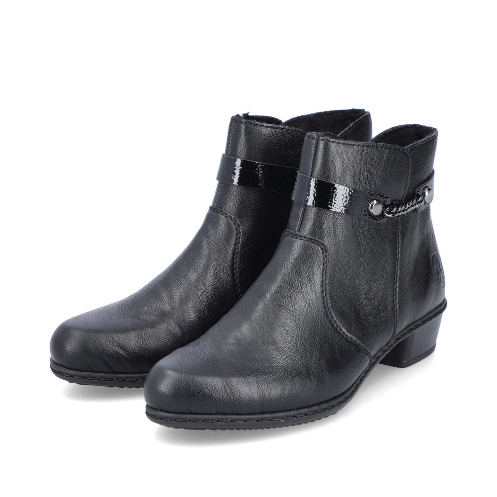 Rieker Y0783-00 women's black side zip ankle boots, paired three-quarter view.