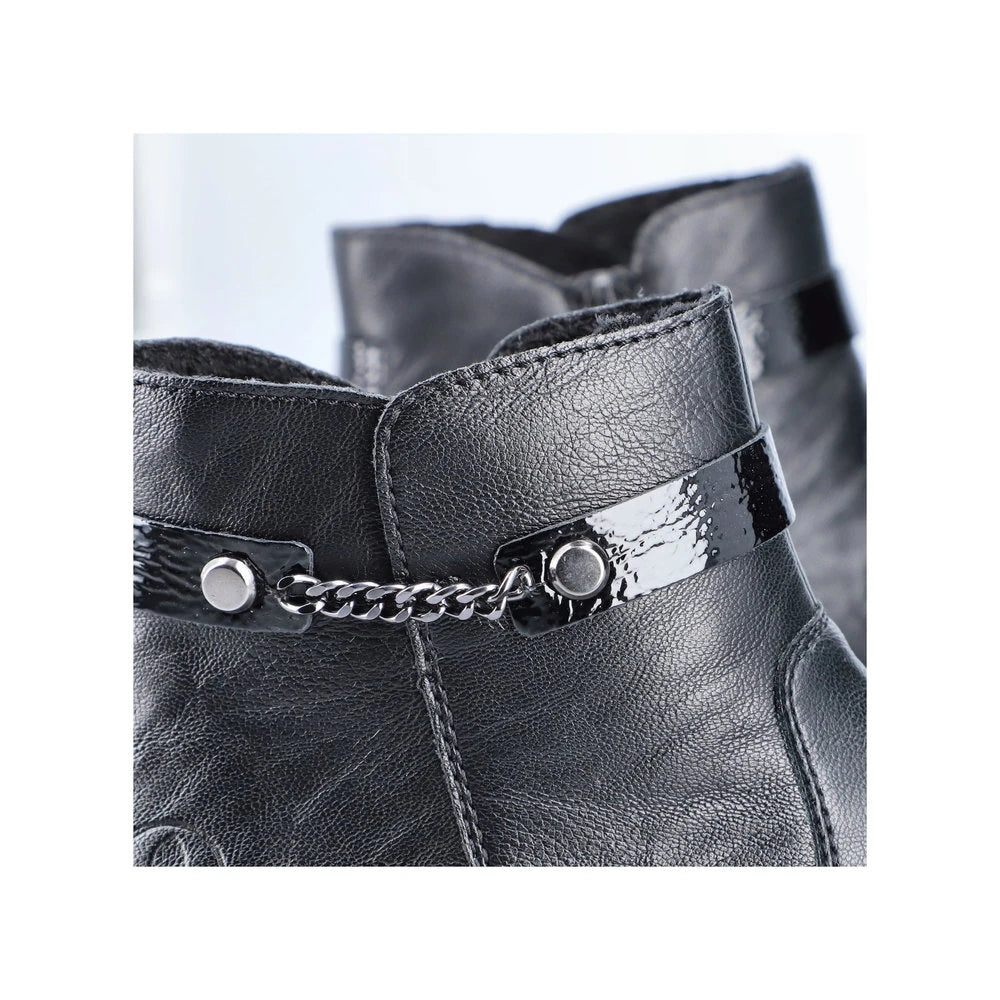 Rieker Y0783-00 women's black side zip ankle boots, lifestyle view.