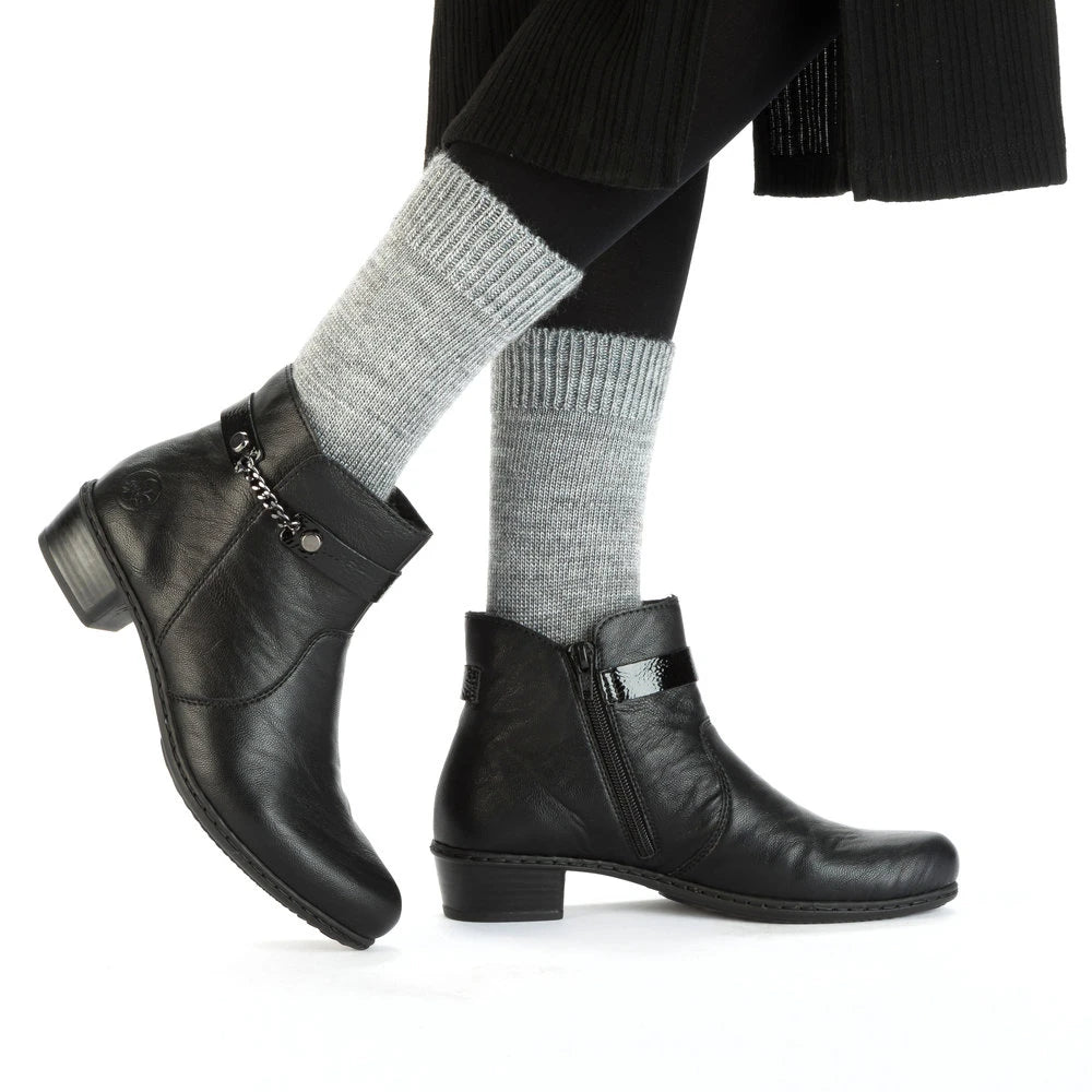 Rieker Y0783-00 women's black side zip ankle boots, lifestyle view 1 of 4.