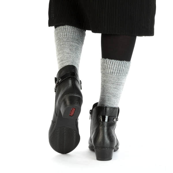 Rieker Y0783-00 women's black side zip ankle boots, lifestyle view 3 of 4.