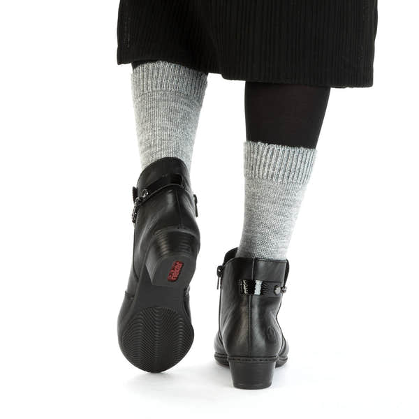 Rieker Y0783-00 women's black side zip ankle boots, lifestyle view 4 of 4.