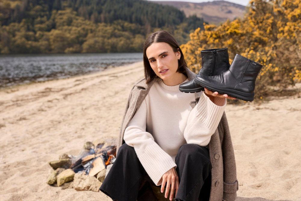 Rieker Z0066-00 women's black leather water resistant side zip ankle boots, lifestyle view 1 of 12.