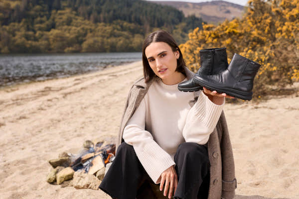 Rieker Z0066-00 women's black leather water resistant side zip ankle boots, lifestyle view 1 of 12.