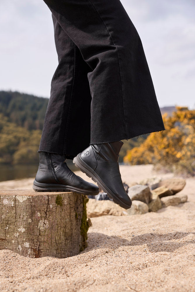 Rieker Z0066-00 women's black leather water resistant side zip ankle boots, lifestyle view 4 of 12.