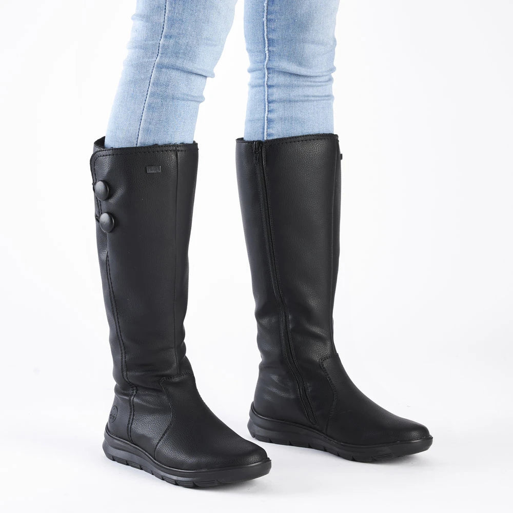 Rieker Z0090-00 women's black water resistant side zip knee high boots, on-foot lifestyle view.