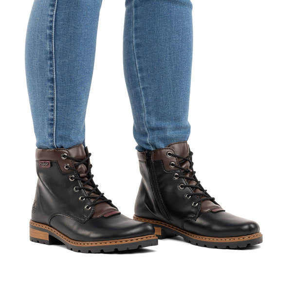 Rieker Z9340-00 women's black zip & lace ankle boots, on-foot lifestyle view.