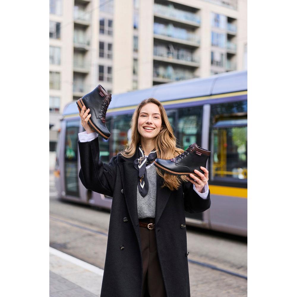 Rieker Z9340-00 women's black zip & lace ankle boots, lifestyle view 1 of 8.
