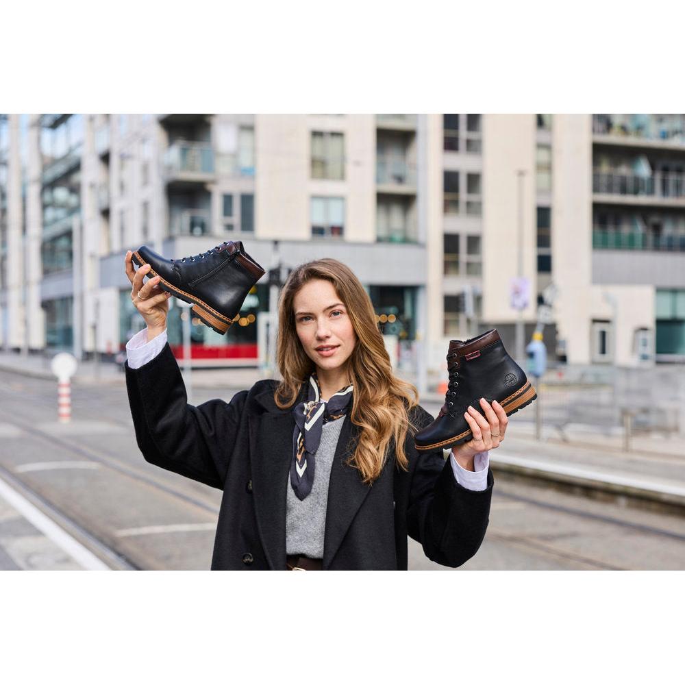 Rieker Z9340-00 women's black zip & lace ankle boots, lifestyle view 2 of 8.