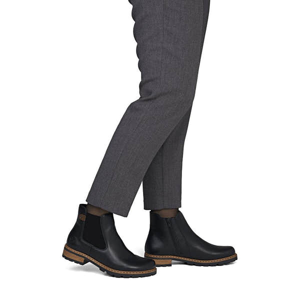 Rieker Z9340-00 women's black zip & lace ankle boots, on-foot lifestyle view.