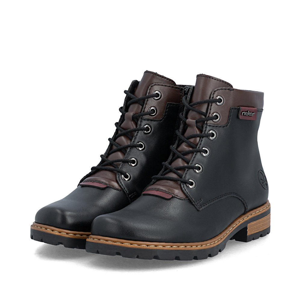 Rieker Z9354-00 women's black side zip ankle boots, paired three-quarter view.