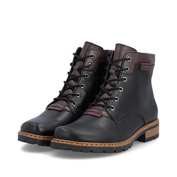Rieker Z9354-00 women's black side zip ankle boots, paired three-quarter view.