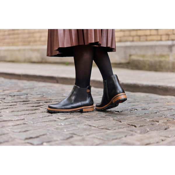 Rieker Z9354-00 women's black side zip ankle boots, lifestyle view 7 of 8.