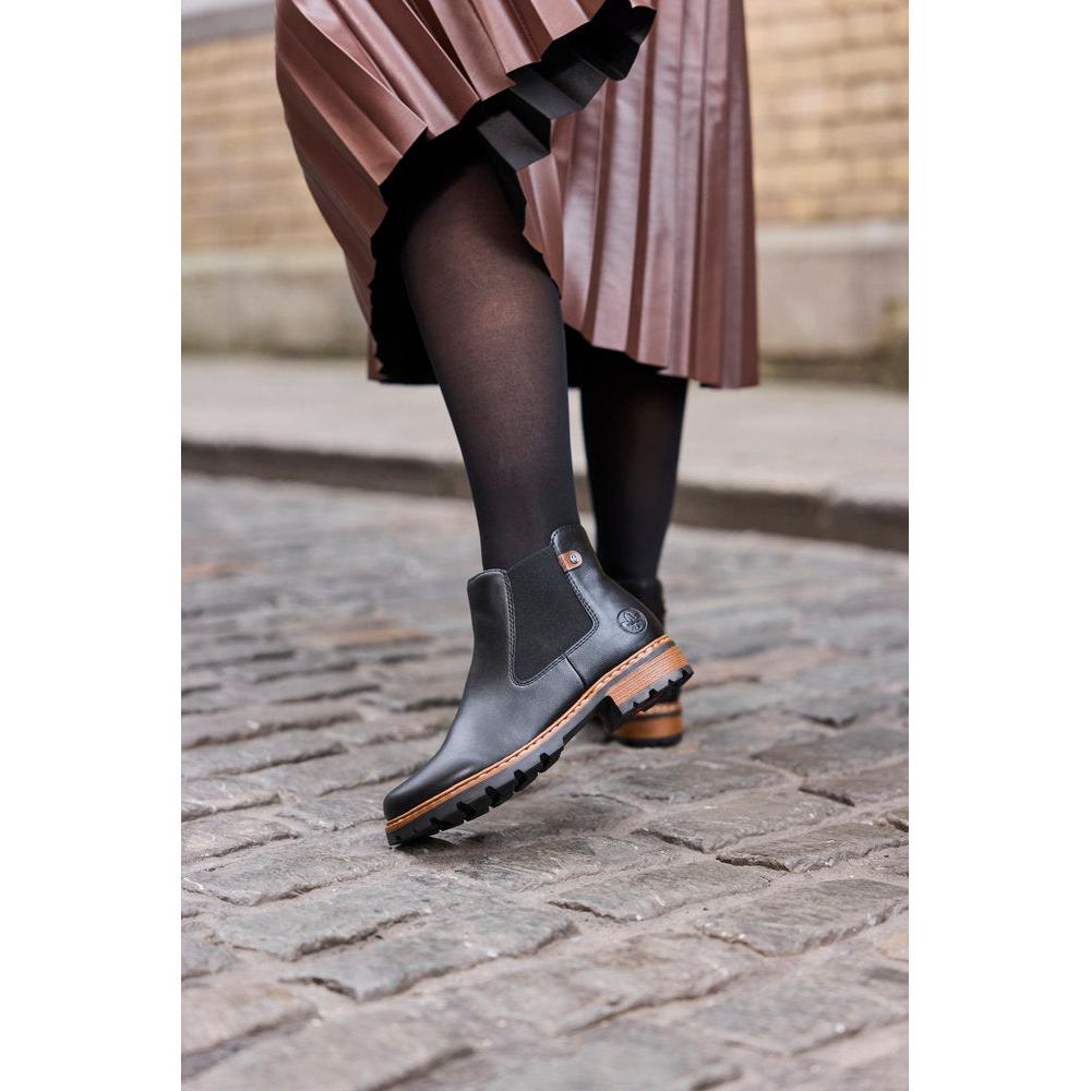 Rieker Z9354-00 women's black side zip ankle boots, lifestyle view 8 of 8.