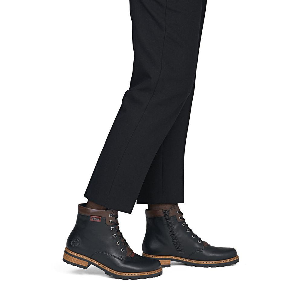 Rieker Z9354-00 women's black side zip ankle boots, on-foot lifestyle view.
