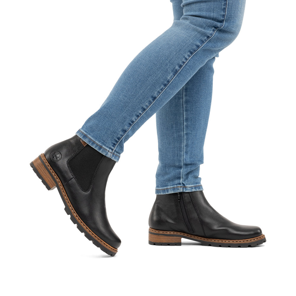 Rieker Z9354-00 women's black side zip ankle boots, lifestyle view 1 of 8.
