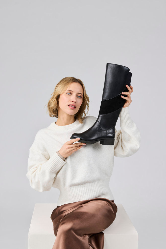 Rieker Z9566-00 women's black leather water resistant side zip knee high boots, lifestyle view 1 of 4.