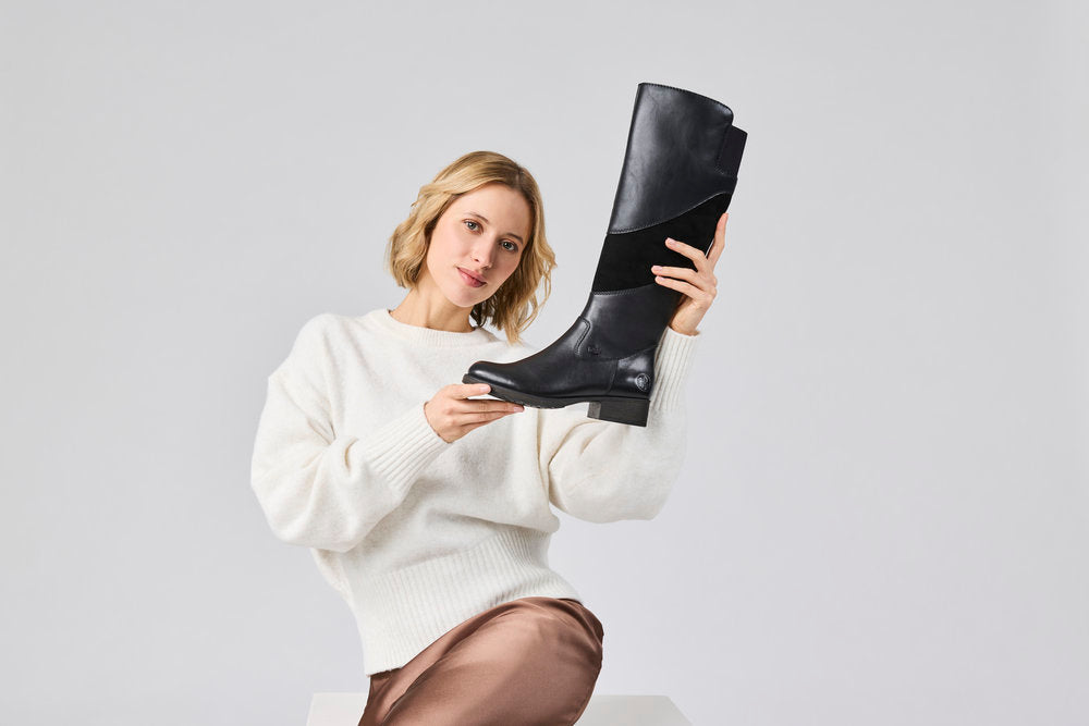Rieker Z9566-00 women's black leather water resistant side zip knee high boots, lifestyle view 2 of 4.
