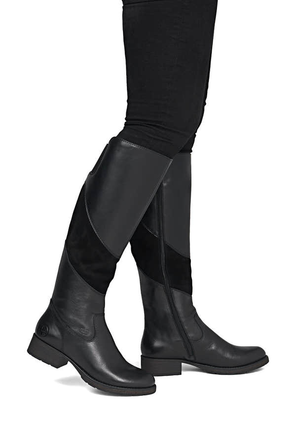 Rieker Z9566-00 women's black leather water resistant side zip knee high boots, on-foot lifestyle view.