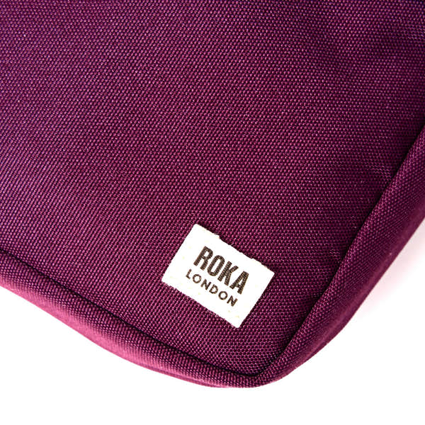 Roka Bond Cherry Lacquer Recycled Canvas One Size, brand label detail.